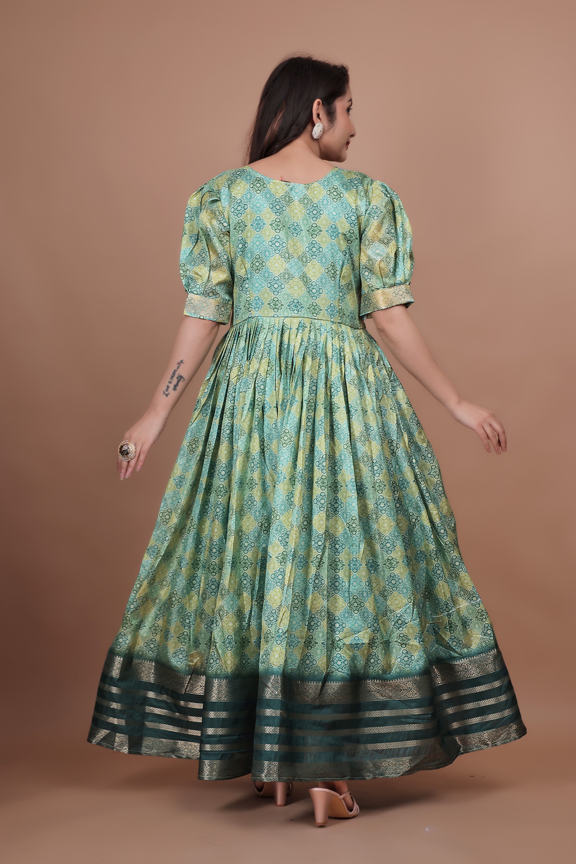 Green Pure Dolla Silk Designer Gown for Women – Zari Woven Border | 5 Meter Flair | Fully Stitched & Ready to Wear