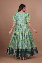 Green Pure Dolla Silk Designer Gown for Women – Zari Woven Border | 5 Meter Flair | Fully Stitched & Ready to Wear