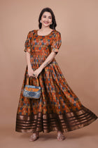 Maroon Pure Dolla Silk Designer Gown for Women – Zari Woven Border | 5 Meter Flair | Fully Stitched & Ready to Wear